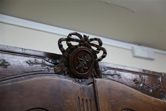 A large 19th century French walnut armoire, H.7ft 9in. W.5ft